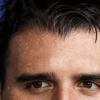 Man with sweat on his forehead.