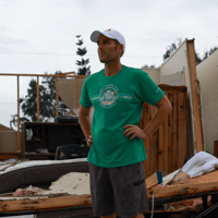 Shane Ostrander stands in front of his damaged house after Hurricane Milton made landfall, in Lakewood Park, Florida, on October 11, 2024. REUTERS/Jose Luis Gonzalez