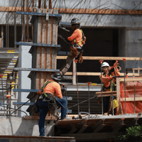 Construction workers build a residential high rise on Oct. 2, 2023 in Miami. Credit: Joe Raedle/Getty Images