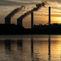 The coal-fired Plant Scherer stands in the distance in Juliette, Ga., in 2017.
