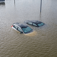 Two cars in a flood.
